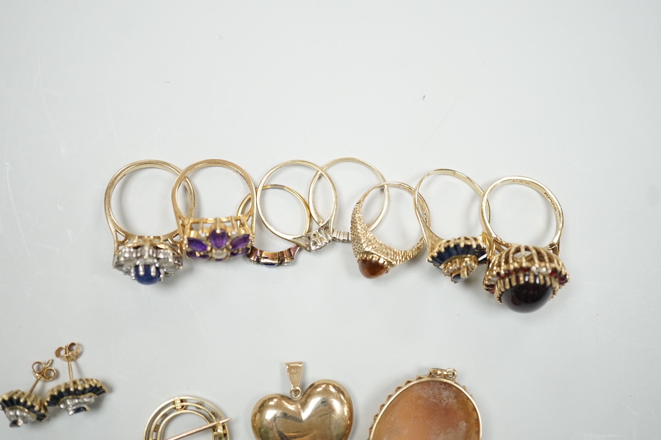 Eight assorted mainly modern 9ct gold and gem set dress rings, including amethyst and split pearl cluster, gross weight 30.7 grams, a 15ct, ruby and seed pearl set open work circular brooch, gross 2.6 grams, pair of 9ct,